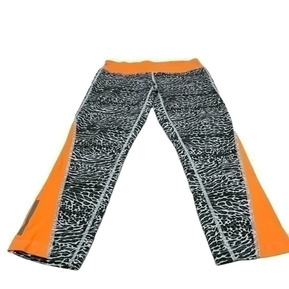 Nike Dri-Fit Women Cropped Leggings Medium | Black White Orange